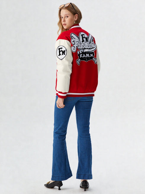 Person wearing a red and white varsity jacket with patches on a white background