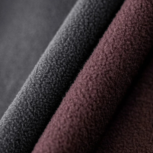 Close-up of textured black and brown fabric on a dark background