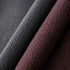 Close-up of textured black and brown fabric on a dark background