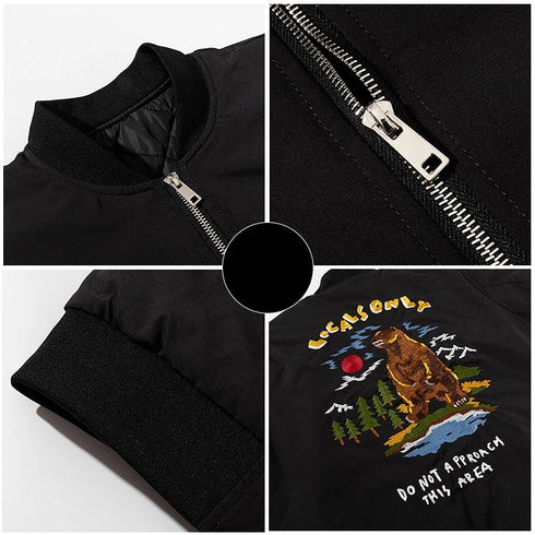 Black jacket with embroidered bear design on a white background