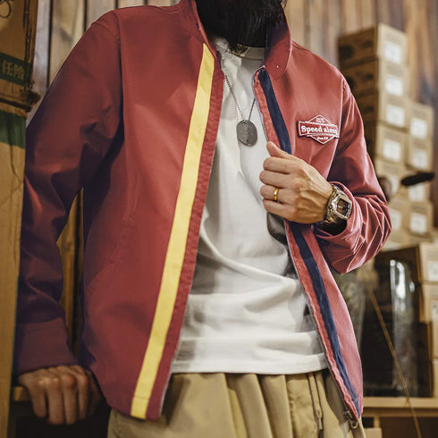 Person wearing a red jacket with a brand logo in an indoor setting