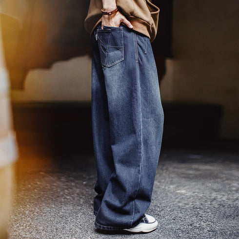 Person wearing blue jeans with a blurred background