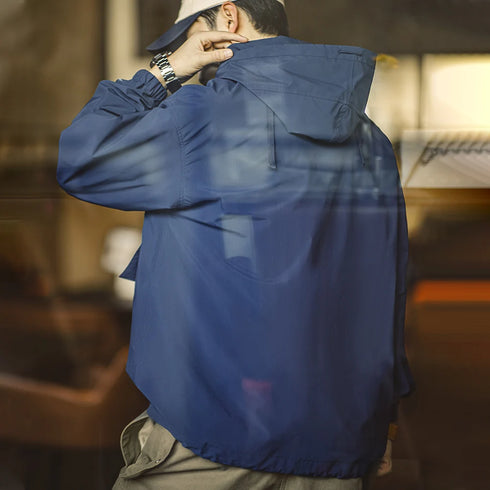 Person wearing a blue jacket in an indoor setting
