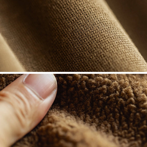 Close-up of brown fabric texture with a finger touching it