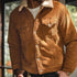 Brown corduroy jacket with sherpa lining worn by a person, blurred background