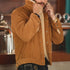 Man wearing a brown corduroy jacket with a blurred background