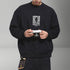 Black Japanese streetwear sweatshirt with graphic print and relaxed fit worn by man holding camera