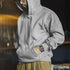 Vintage Heavyweight Rocky Hoodie in grey with drawstring hood and front pocket, worn casually