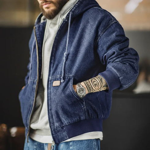 Retro denim jacket with hood, zipper closure, ribbed hem, and front pockets, styled for casual streetwear.
