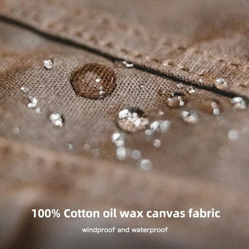 Close-up of 100% cotton oil wax canvas fabric with water droplets, labeled as windproof and waterproof.