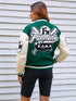 Person wearing a green and beige varsity jacket with 'F.M. Fanmin' branding.
