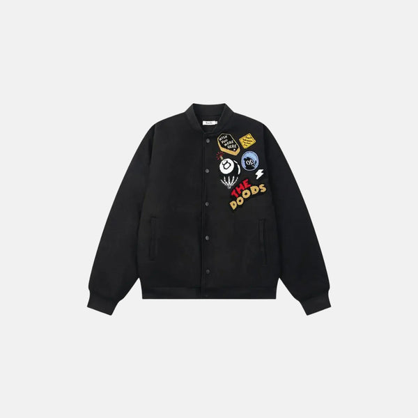 Black jacket with colorful patches on a light gray background