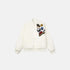 White jacket with colorful patches on a white background