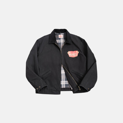Black jacket with plaid lining on a light gray background