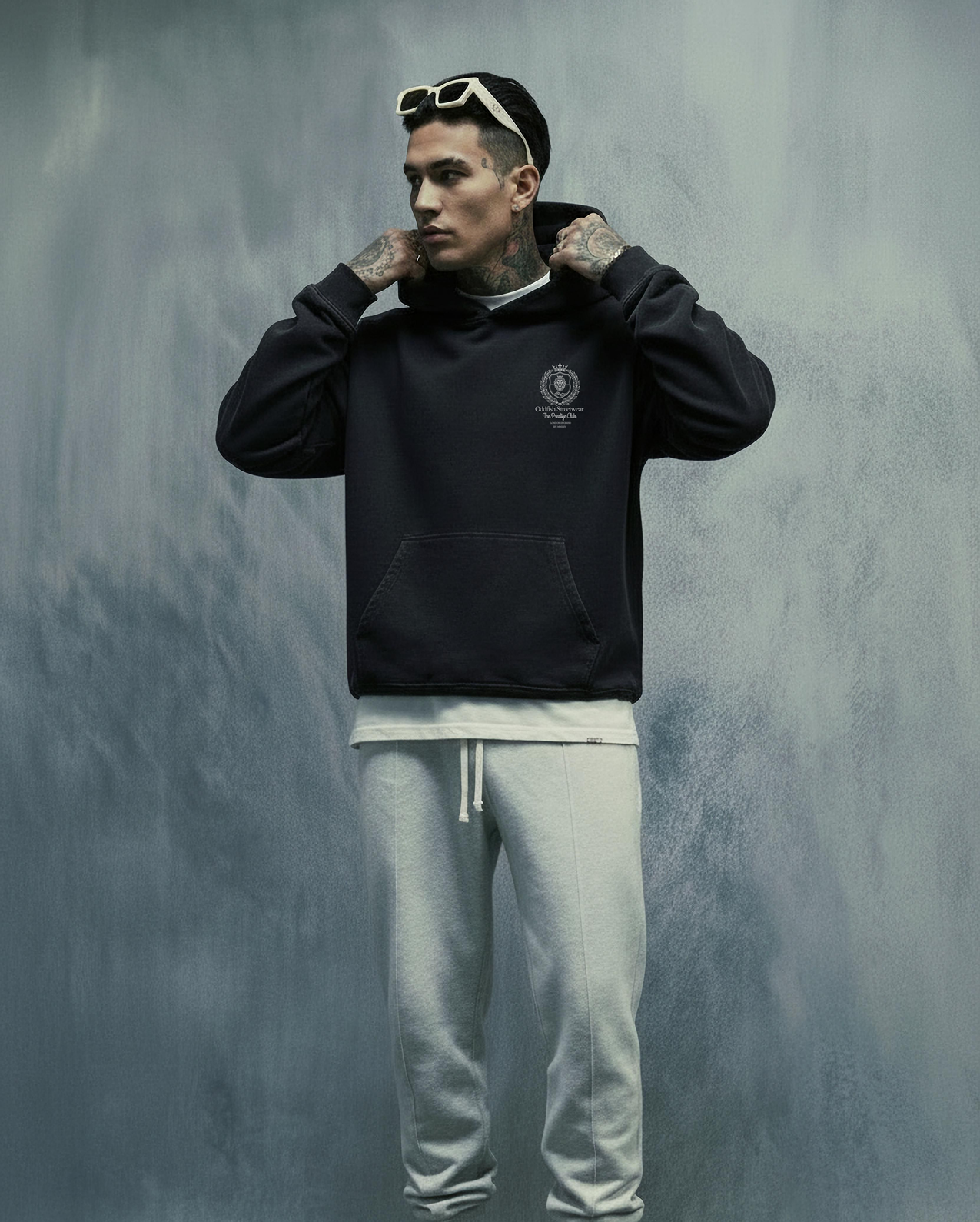 Person wearing hoodie gray blue