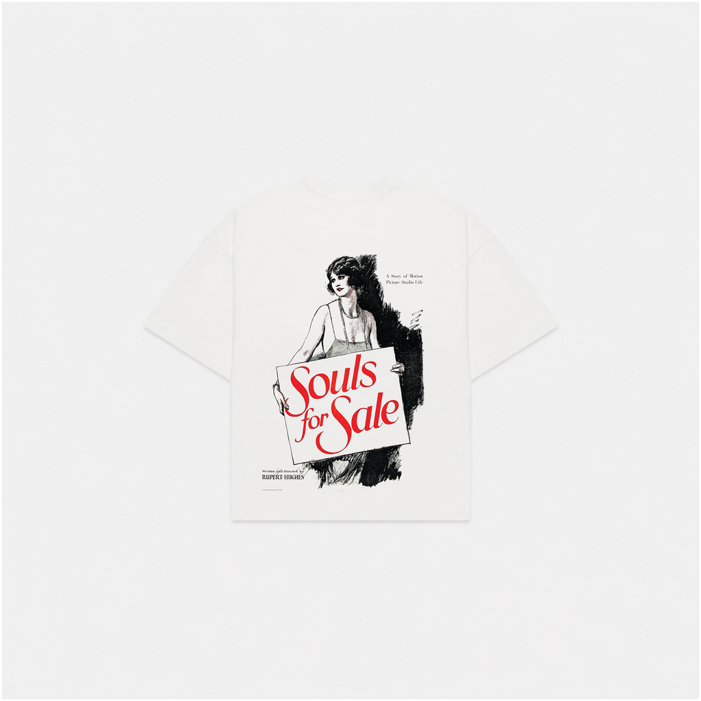 A white short-sleeve t-shirt with a graphic print of a woman holding a sign that reads 'Souls for Sale' in red script, displayed on a light gray background.